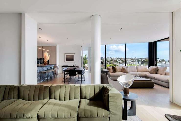 Home stager Janine King, of Janine King Design, with her secret weapons: cushions. Photo / Supplied