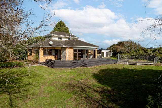 Brick home plus stable block on flat land.