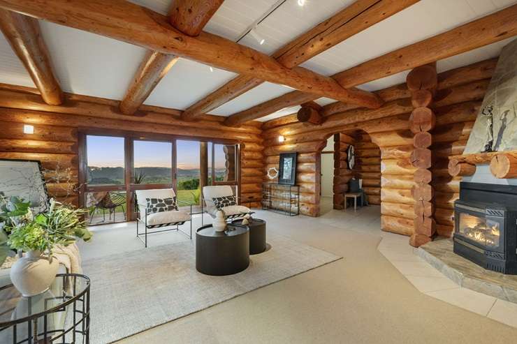 A three-bedroom log cabin on 7.46ha goes to auction on May 21. Photo / Supplied