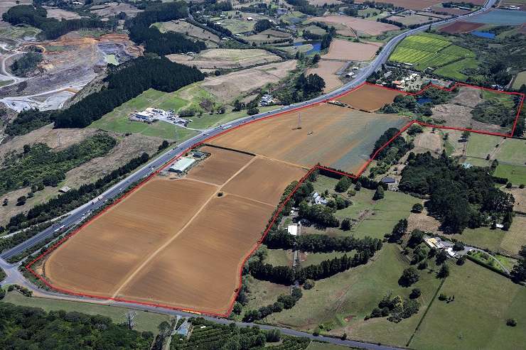 aerial view of tree-line country land with subdivision in background.   169 Park Estate Road, Hingaia, near Karaka and Papakura, South AUckland