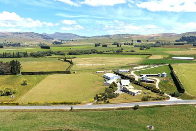 Substantial Home With Sheds Galore!