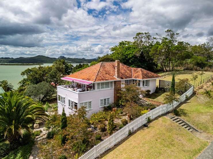 A four-bedroom character home with panoramic views of Rawene harbour is up for grabs. Photo / Supplied