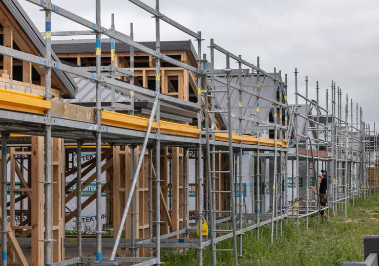 Houses under construction in Westgate, Auckland. The suburb is one of several that have seen a surge in new home listings. Photo / Alex Burton