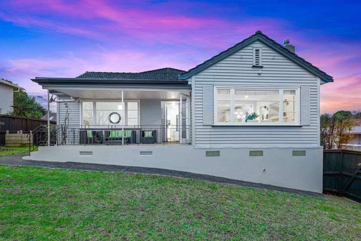 A four-bedroom home on Castleford Street, in Green Bay, Auckland, sold under the hammer for <img.4m - $50,000 above its 2021 CV. Photo / Supplied