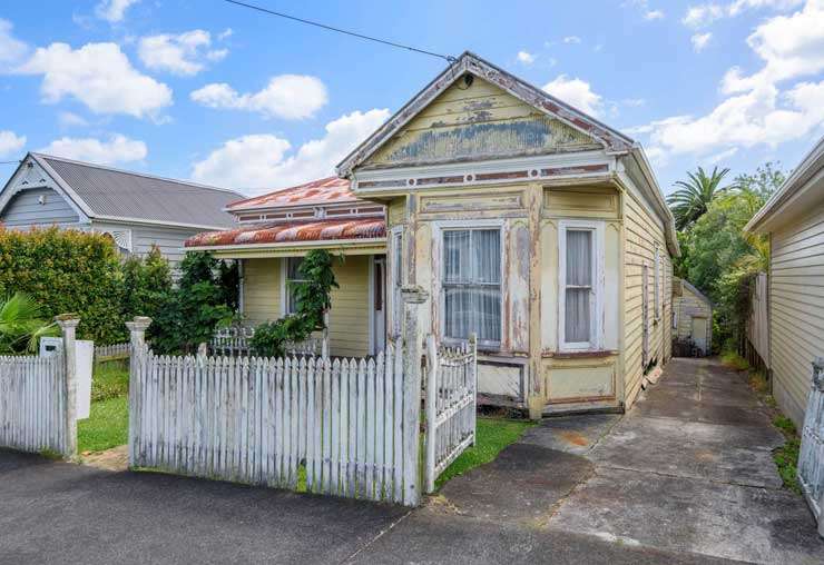 white bay front villa with hedge and picket gate at 17 Harcourt Street, Grey Lynn, Auckland