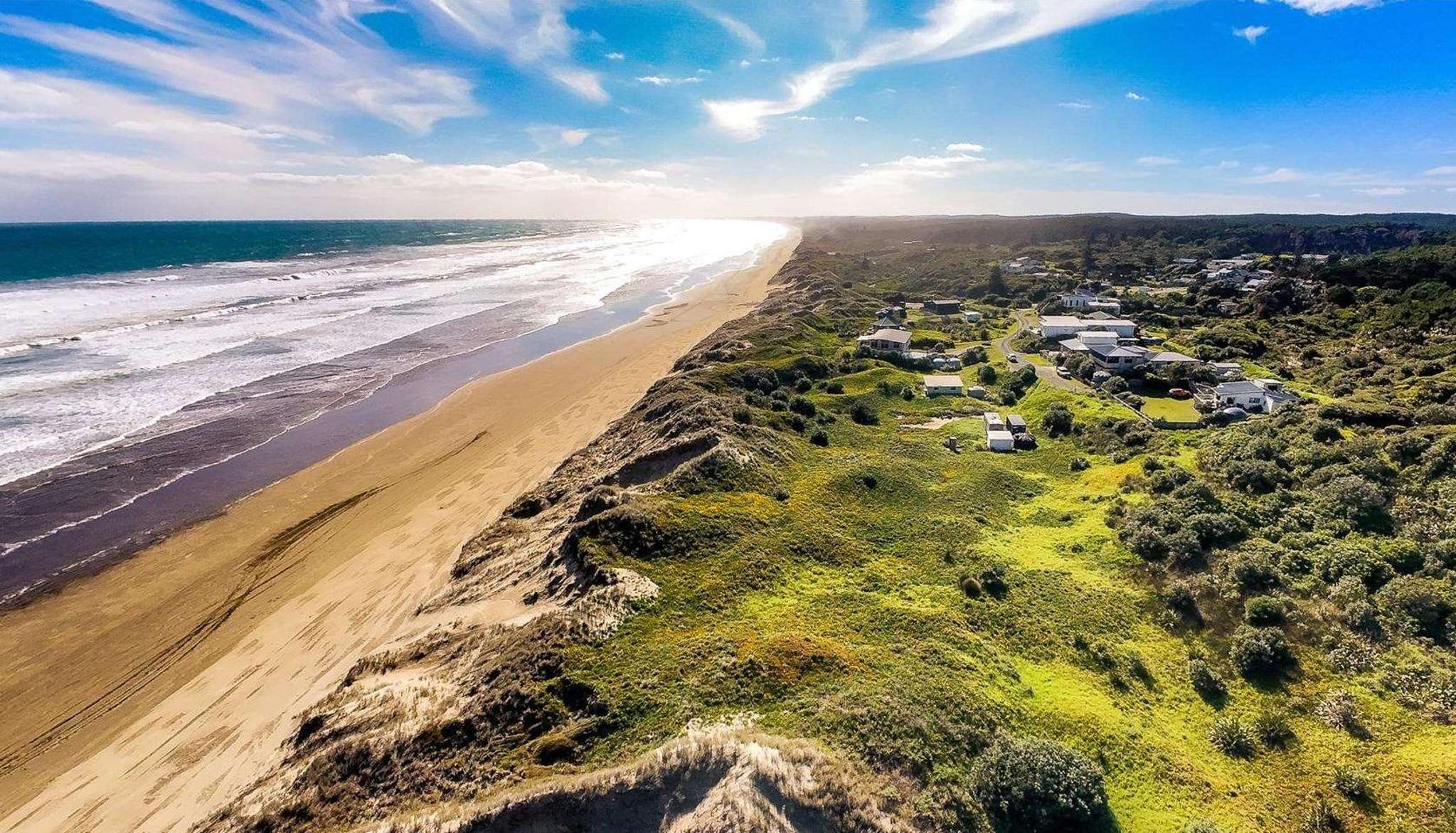 Out-of-towners pay $265,000 for a beach toilet - and a whole lot of sand