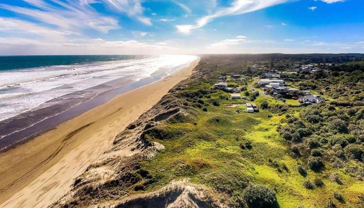 Out-of-towners pay $265,000 for a beach toilet - and a whole lot of sand