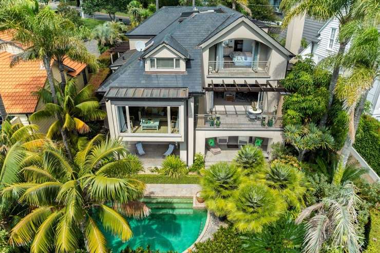 A luxury home at 12 Lammermoor Drive, in St Heliers, Auckland, sits on a 1433sqm section and comes with a swimming pool and tennis court. Photo / Supplied