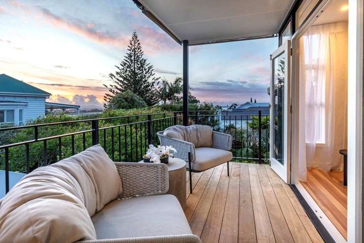 The two-storey townhouse for sale at 99 Marine Parade, in Herne Bay, Auckland, has been pitched as a lock-up and leave. Photo / Supplied