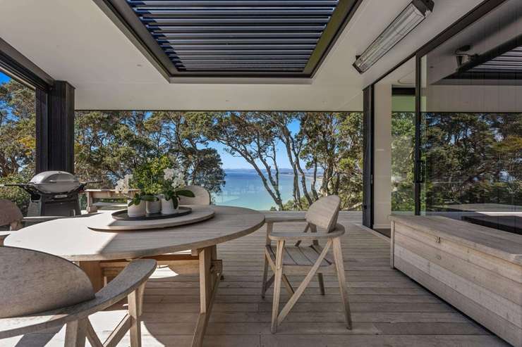 A near-new bach at 90 Otarawairere Road, in Ōhope's exclusive Otarawairere Village, is up for grabs. Photo / Supplied