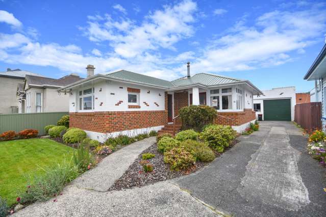 Super tidy brick home with massive garaging