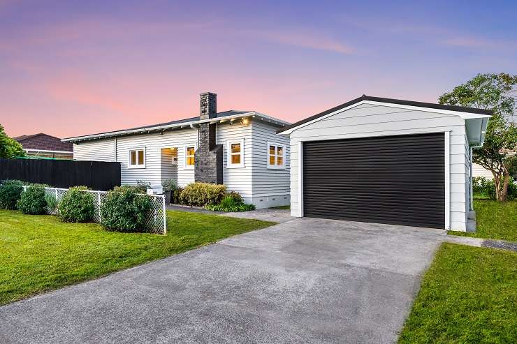 Ten bidders registered for the auction of a three-bedroom bungalow on Korokino Road, Greenlane, which sold for <img.825m. Photo / Supplied