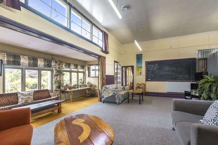 The former Taylorville School, in Greymouth, has been transformed into a massive eight-bedroom, four-bathroom home with two kitchens. Photo / Supplied