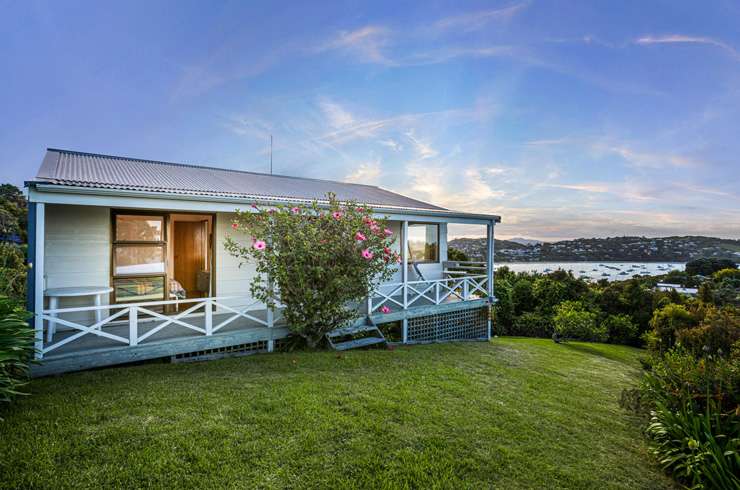 A four-bedroom house on Hill Road, in Palm Beach, with views of the beach and Hauraki Gulf, sold under the hammer for $6.031m. Photo / Supplied