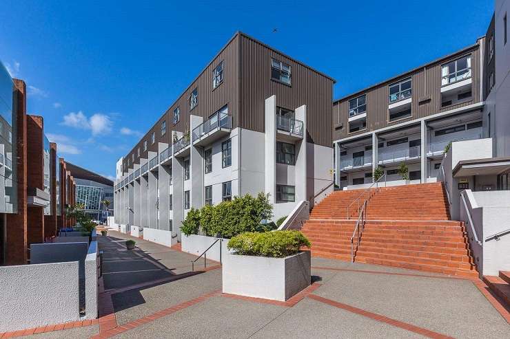 apartment building above white wall   2 Dockside Lane, Auckland central city