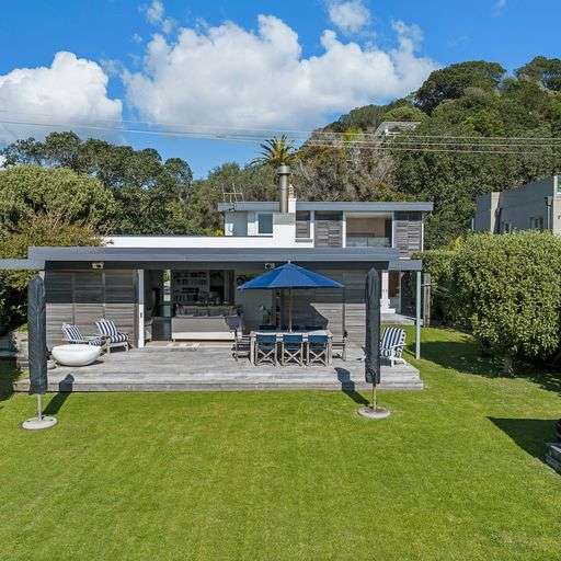 white and timber house with multiple rooves and sea view 66 Kennedy Point Road, Kennedy Point, Waiheke Island