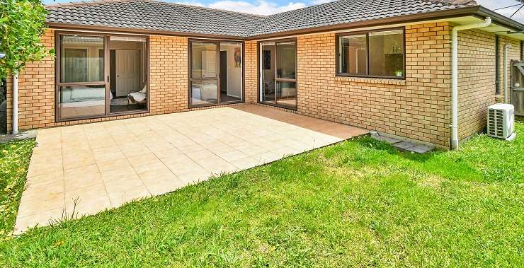 brick house with lawn in front 1 Summit Drive, Mount Albert, Auckland