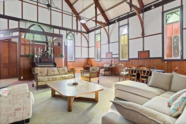 Couple bought 125-year-old church on a whim - put their bed next to the pulpit