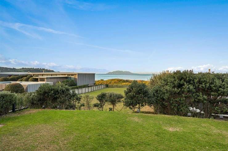 A four-bedroom bach at 6 Taiawa Place, Omaha, is up for grabs. Buyers also have the chance to acquire the 1117sqm vacant section in front. Photo / Supplied