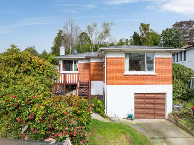 Solid and sunny with three-car garaging!