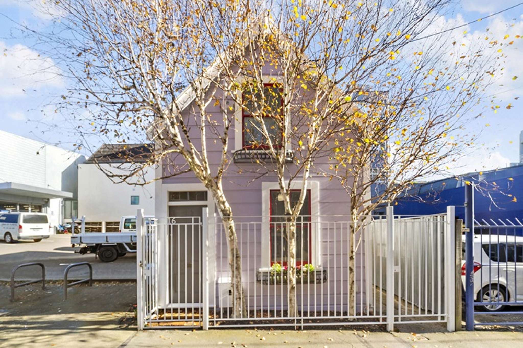 Tiny pink home with colourful past sells for just over $800,000