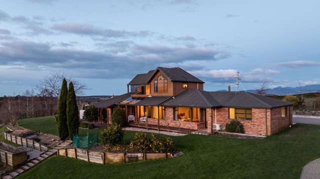 Elevated view home with super large shed