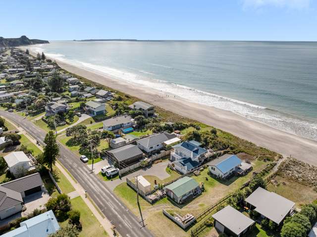 Home and Income with this Beachfront Gem