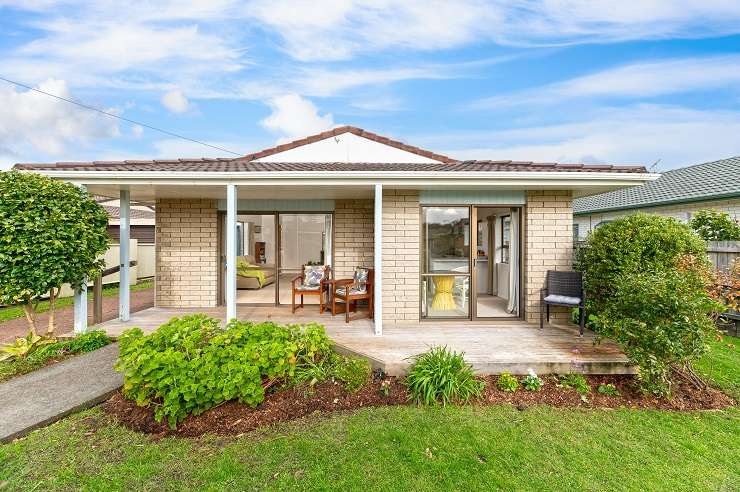 The waterfront home on Lake Pupuke sold for $4.705m - the highest sale at Harcourts Cooper & Co’s mega auction. Photo / Supplied