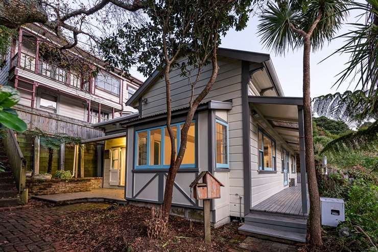 The villa on 62 Pirie Street, in Mount Victoria, Wellington, has a distinctive colour scheme. The window frames and door are painted pink. Photo / Supplied