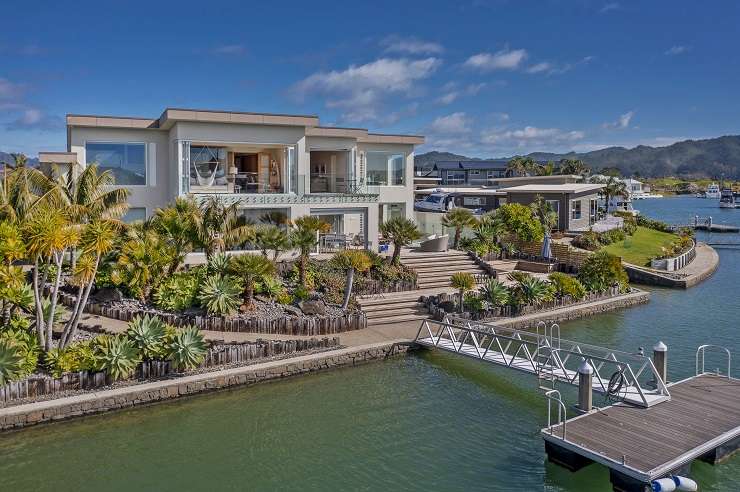 Grey wood house and deck with lawn and views to the water 8 Bay View Way, Ferry Landing, Whitianga Cooks Beach Coromandel Peninsula