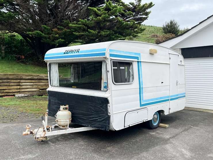 The Block stars Alice and Caleb Pearson in the 1980s Zephyr caravan they waved goodbye to at the weekend. Photo / Supplied