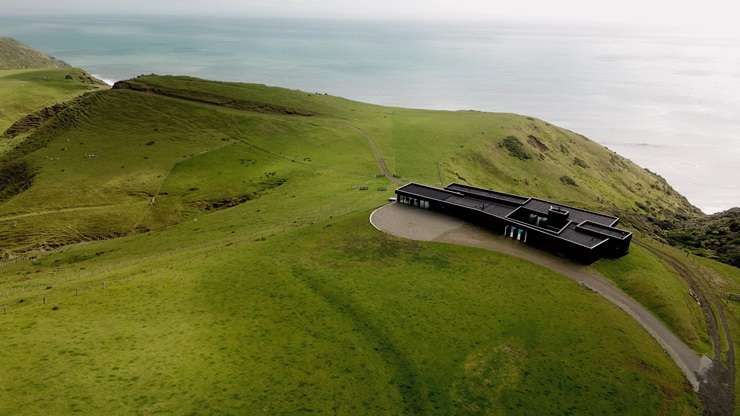 Parihoa Farm, on Constable Road, in Muriwai, Auckland, is one of three adjoining properties that wellness guru Matt Chapman is selling off. Photo / Supplied