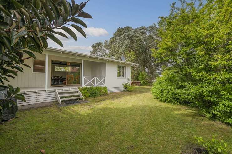 A five-bedroom home on the waterfront at Cooks Beach is on the market for sale. Photo / Supplied