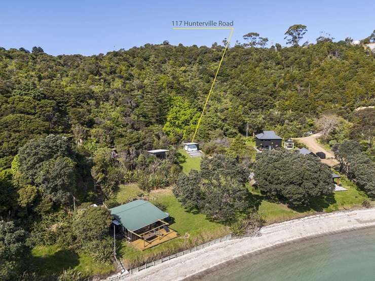A waterfront caravan and section for sale in Pearl Bay, near Orapiu, on Waiheke Island, can be picked up for $799,000. Photo / Supplied