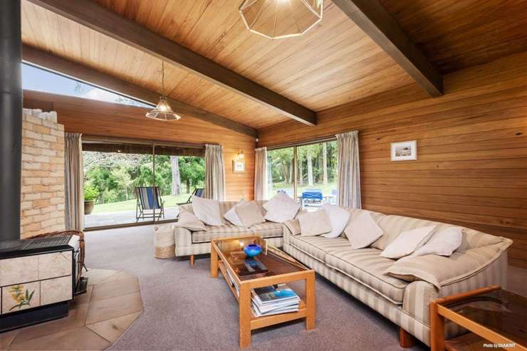 The design of 245 Huia Road, in Auckland's Titirangi, was based on plans that a US architect had drawn up for another home. Photo / Supplied