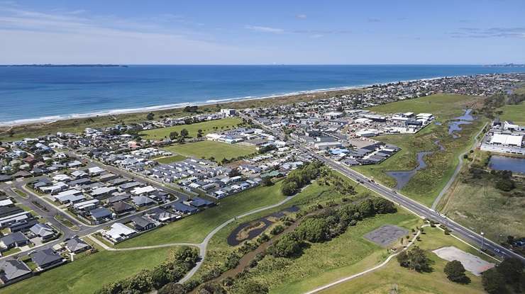 An aerial view of houses in Tauranga, one of the property hotspots buyers are encouraged to check out in 2024. Photo / Getty Images