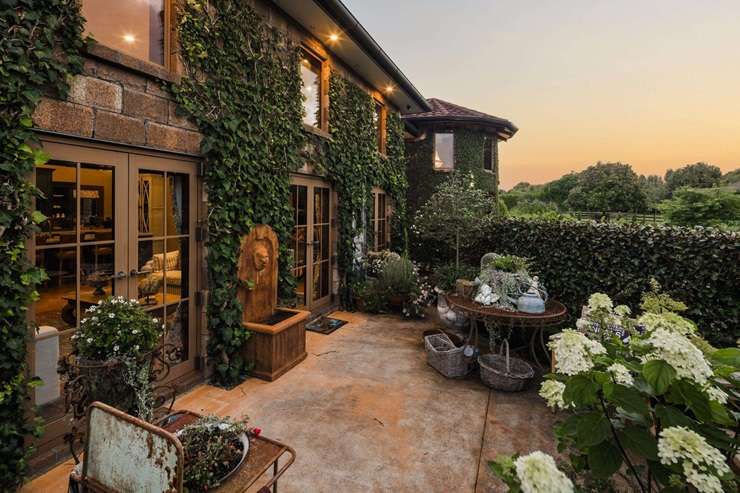 Corina Montgomery and David Lawrence are selling their French chateau, which looks centuries old but was completed in 2018. Photo / Supplied