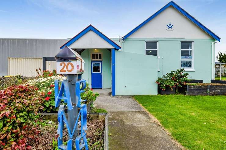 The former Freemason's hall at 20 Domett Street, in the Taranaki town of Waitara, has been given a colourful makeover. Photo / Supplied