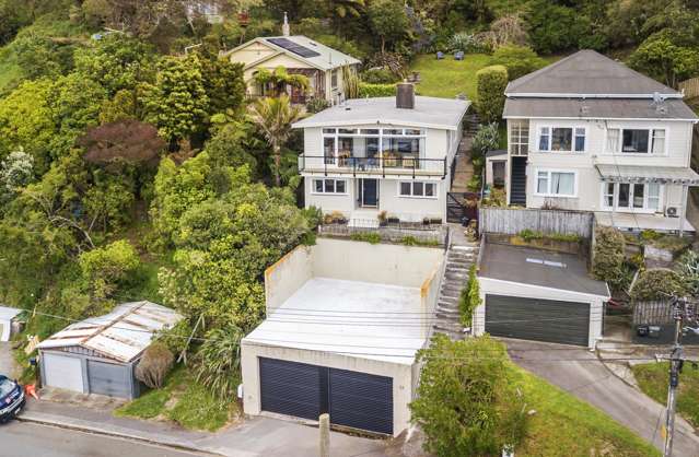 VERSATILE & PRIVATE WITH FIVE BEDROOMS & OVERSIZED GARAGE