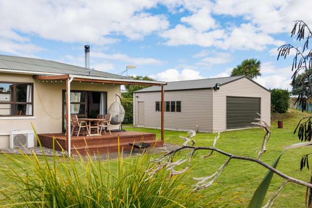 Large shed, family home and a garage with studio!