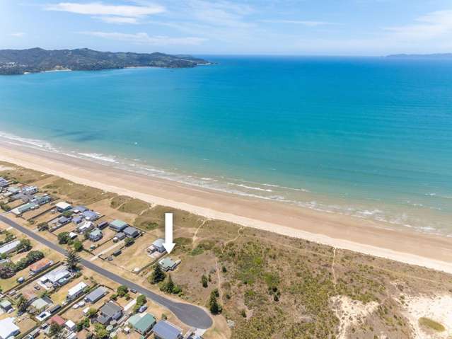 Absolute beachfront with classic kiwi bach