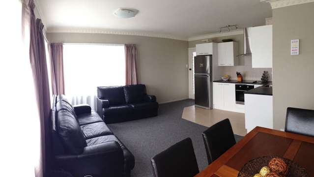 Warm, easy-care 3-bedroom Unit, lawn included