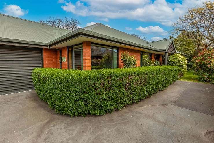 There were six bidders fighting it out for the house in Coniston Avenue, Ilam, that sold for a surprising <img.202m. Photo / Supplied