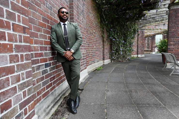 Barfoot & Thompson agent Paul Neshausen is wearing a Dolce & Gabbana sequin suit, a Versace shirt and Gucci shoes. Photo / Fiona Goodall