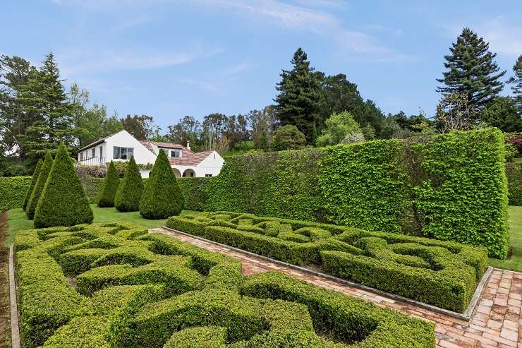 The 1950s arts and crafts property with stunning park-like gardens is on the market after decades of hard work. Photo / Supplied