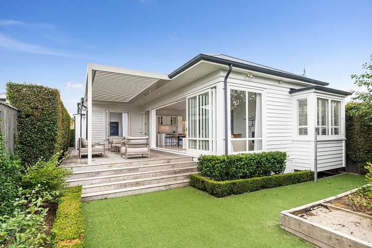 white bay front villa with hedge and picket gate at 60 Rose Road, Grey Lynn, Auckland