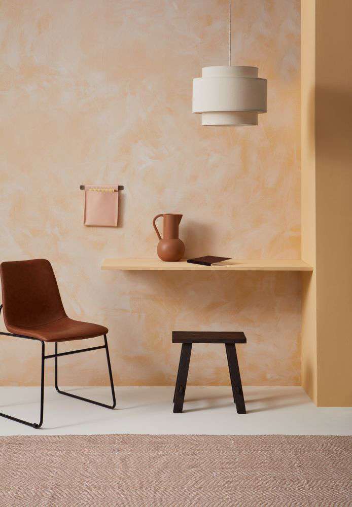 Rustic reds and charcoal floorboards bring earthy variety and texture to a nature-inspired dining room. Floor stain colour washed in Resene Colorwood Shade, walls painted in Resene Rivergum, with skirting in Resene Colorwood Charred Black. Project by Anni
