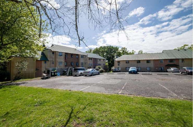 A three-bedroom fire-damaged home on Roscommon Road, in Clendon Park, Auckland, had a <img reserve and sold for $661,000 in a heated auction. Photo / Supplied