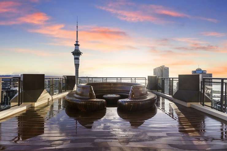 The Batman logo looms large in the luxury apartment at the top of the Metropolis tower in Auckland Central. Photo / Supplied