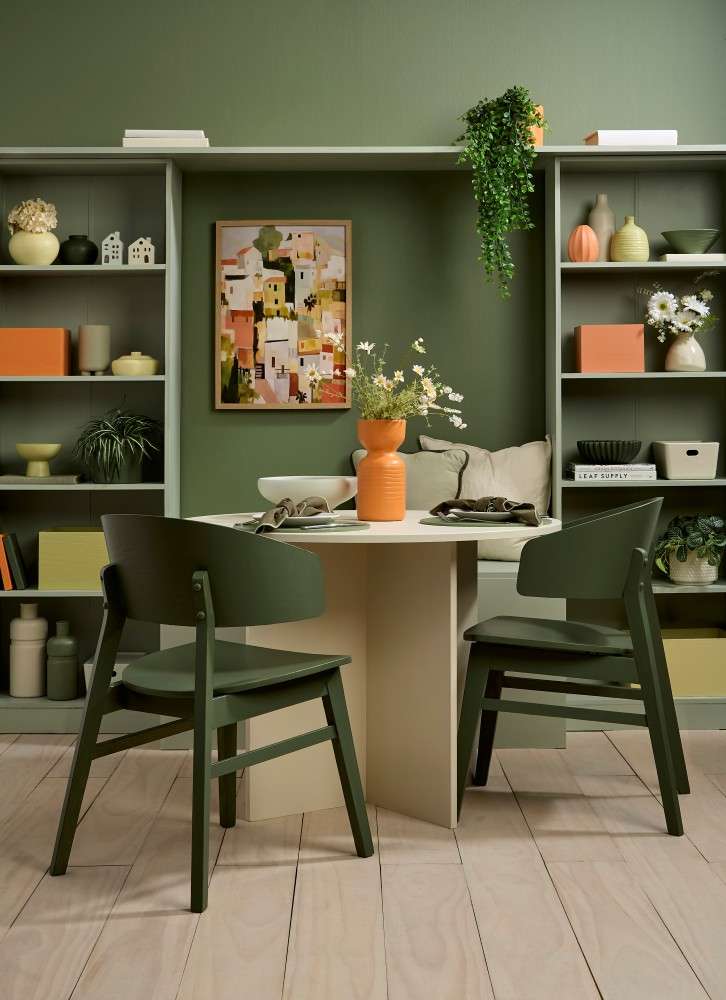 Rustic reds and charcoal floorboards bring earthy variety and texture to a nature-inspired dining room. Floor stain colour washed in Resene Colorwood Shade, walls painted in Resene Rivergum, with skirting in Resene Colorwood Charred Black. Project by Anni